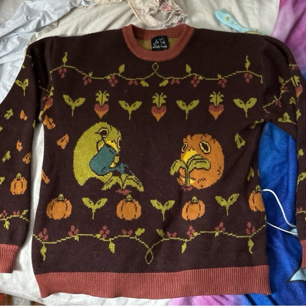 Chunky, brown sweater with cute toad design!